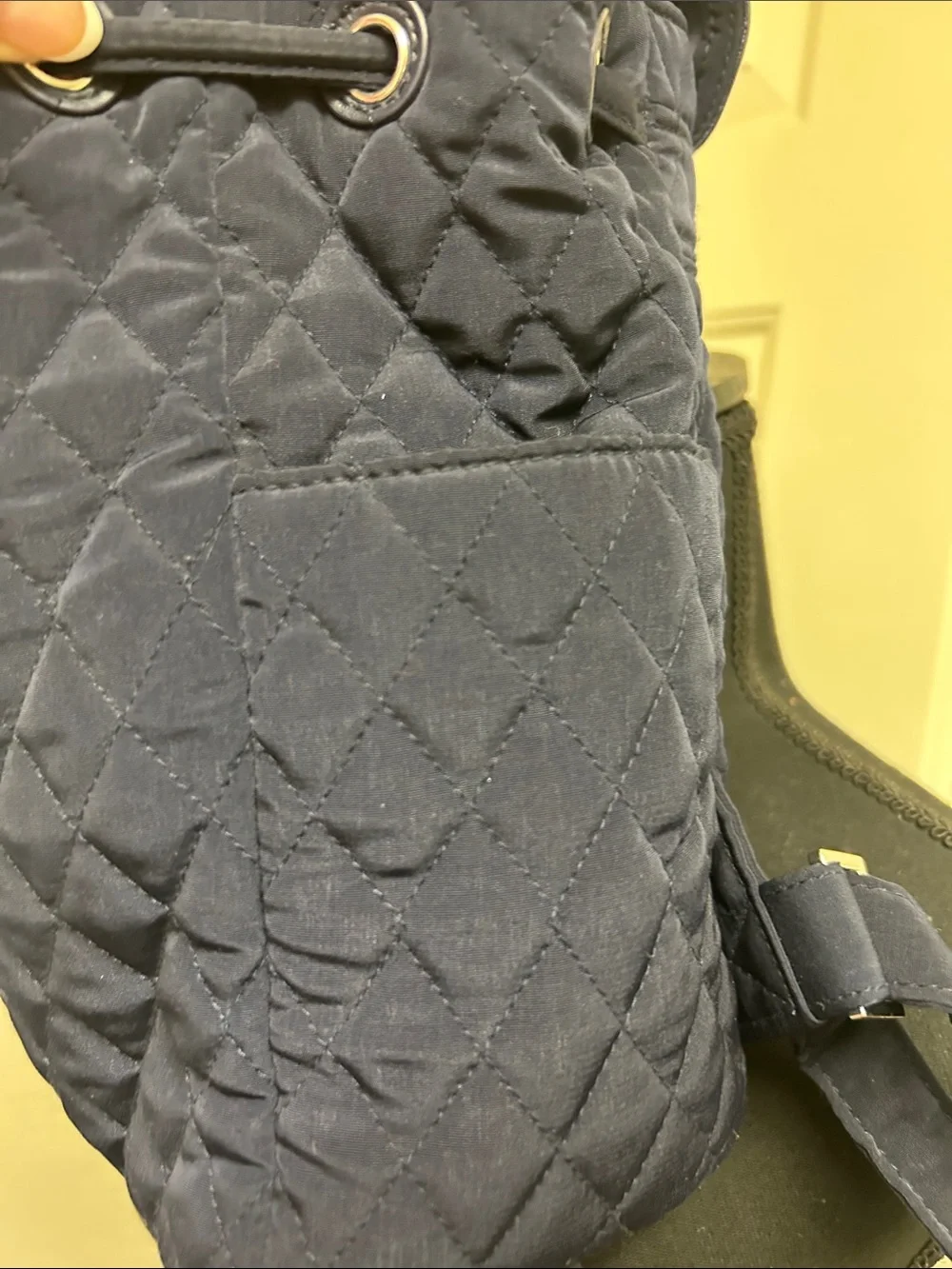 Vera Bradley quilted backpack in navy blue, diamond pattern a front flap closure